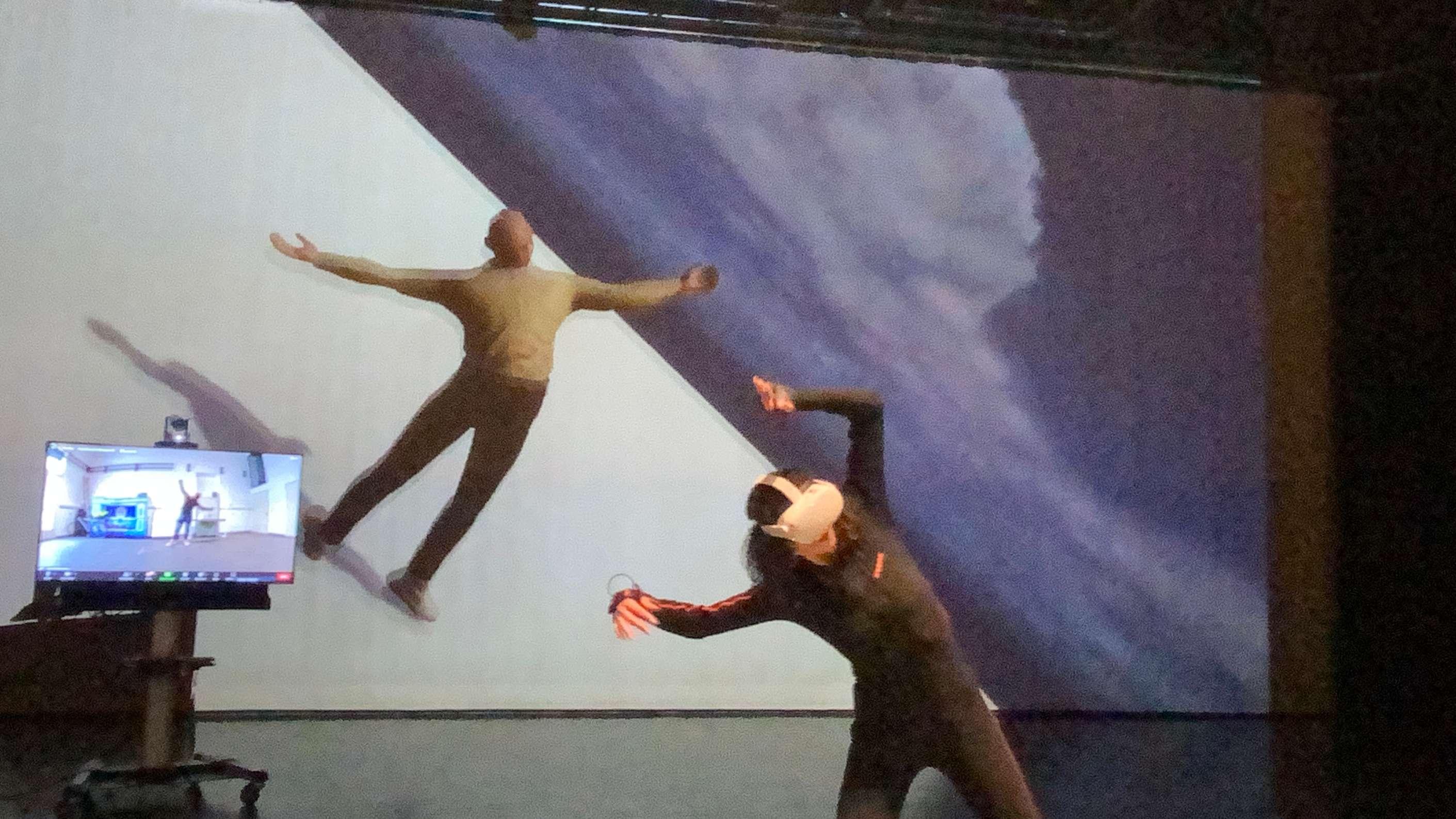 person dancing with VR glasses and avatar in the background